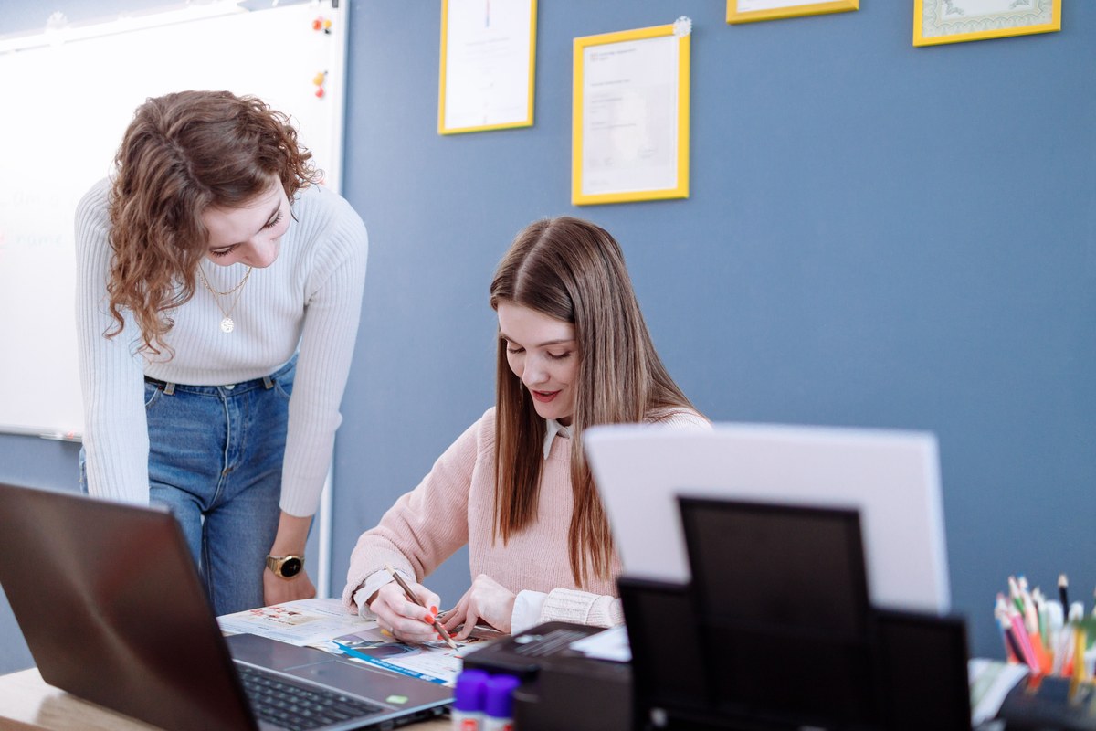 A tutor and a student reviewing a diagnostic SAT score report together